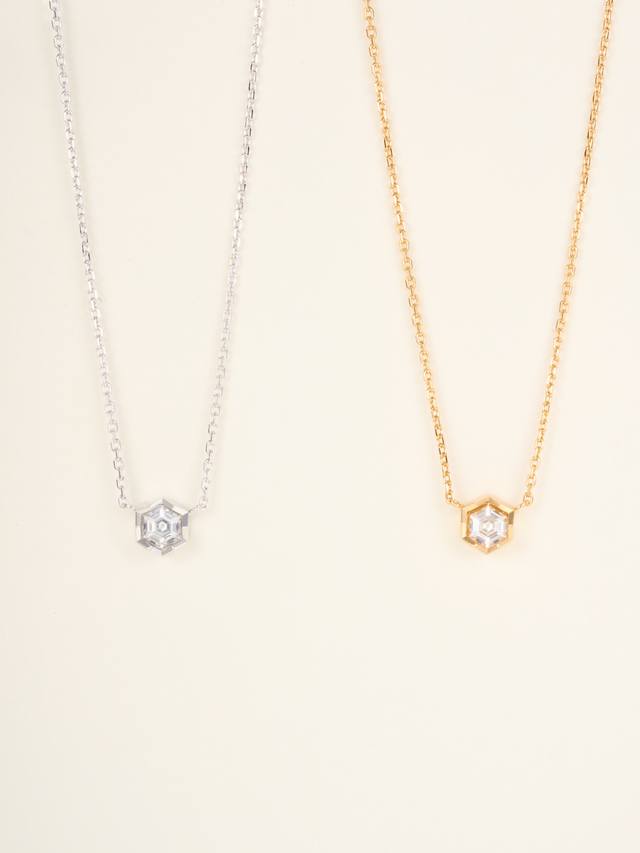 Bee My Love single diamond pendant, set with a queen-cut hexagonal diamond, give