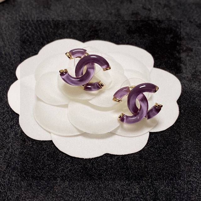 Chanel earrings are light purple and crystal clear. Chanel's styles really need