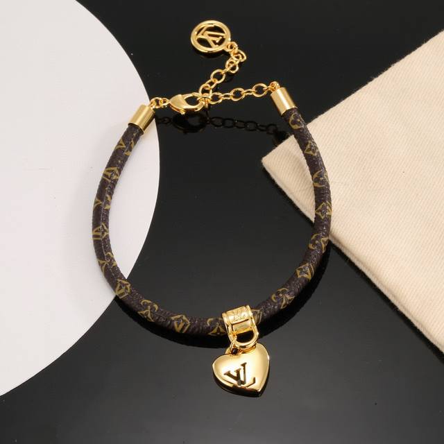 The Lv Circle reversible bracelet features the iconic monogram canvas and gold-t