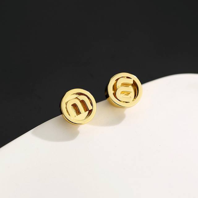 Miu Miu letter earrings are classic gold in color. They are small, exquisite, cu