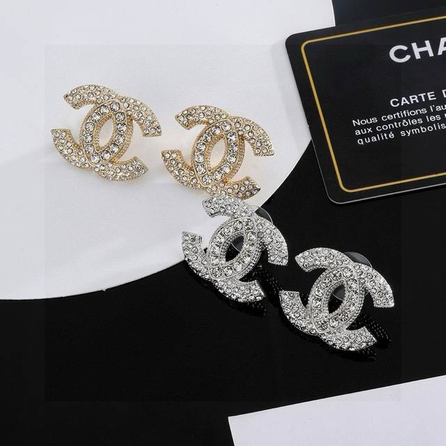 Gold and silver Chanel classic double C earrings. This is a very good-looking ve