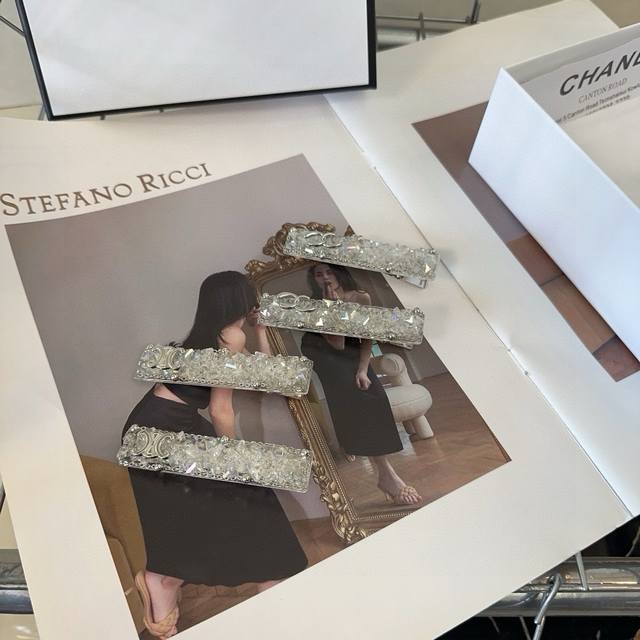 comes with a box, a pair of Chanel Celine Shiny diamond side clip bangs clip, a