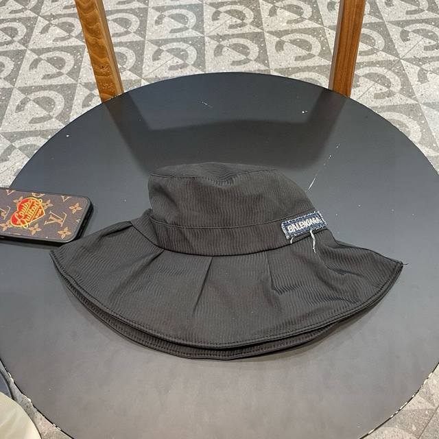 Balenciaga's new washed denim fisherman hat The denim fisherman hat is really a
