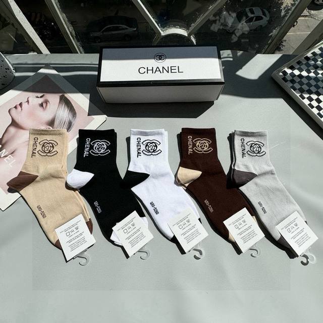 comes with a box of five pairs of Chanel Chanel's popular mid-tube socks, high