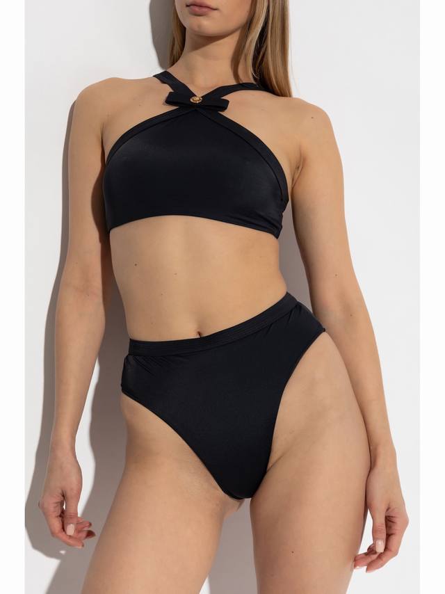 Celine's new bikini top is super cool! Available at all major stores, it natural
