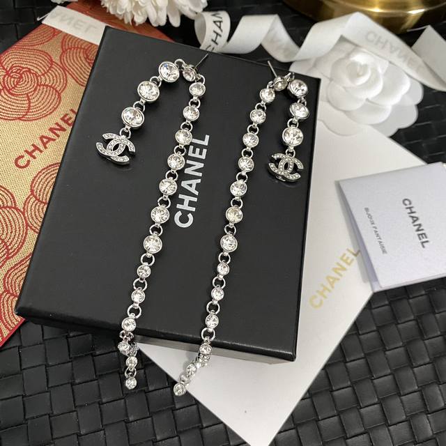 Chanel's latest silver round diamond long earrings are made of brass. The earrin
