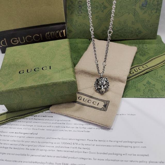 Gucci with vintage palladium finish and lion head pendant DDD