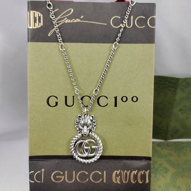 Gucci The pendant of this necklace cleverly combines multiple iconic elements of