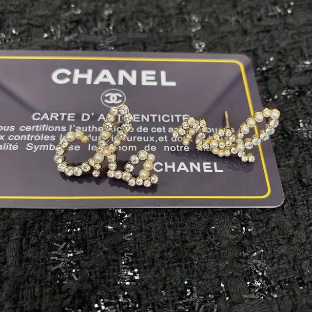 Chanel I really like Chanel's pearl letter earrings. The layers of jewelry form