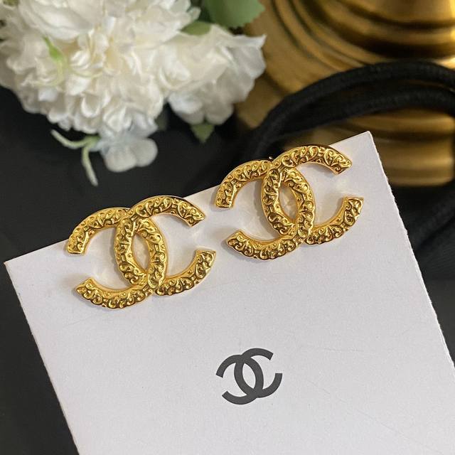 Chanel's exquisitely carved lava texture double C earrings are highly recommend
