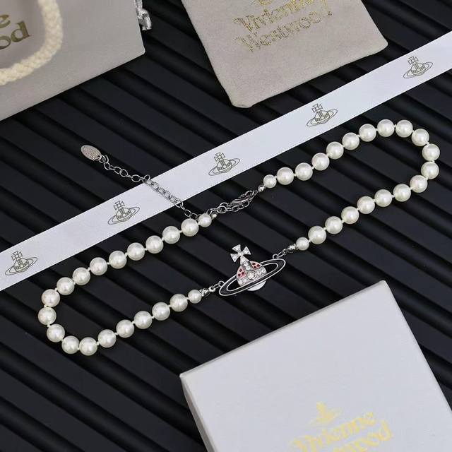 Vivienne Saturn Planet Pearl Necklace In the list of must-have items for women,