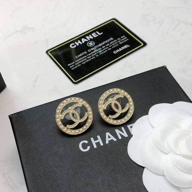 Chanel's new round double C earrings The striking gold metal-coated "double C"