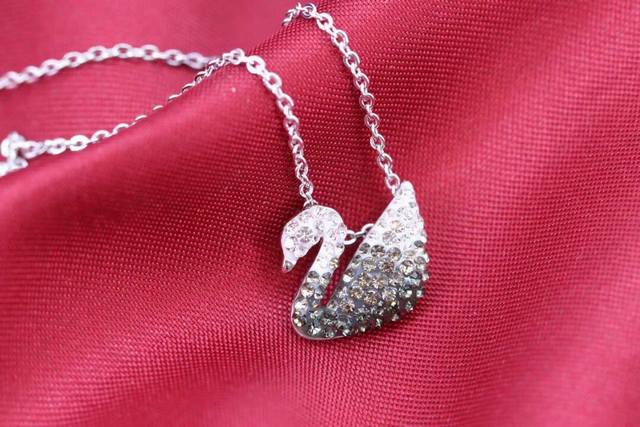Swarovski Small Black Gradient Swan NecklaceThis elegant rhodium-plated pendant
