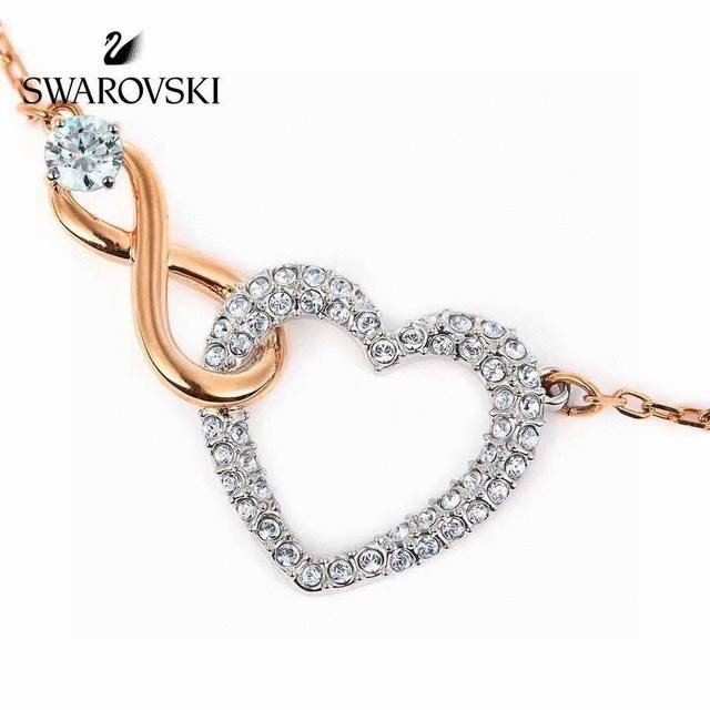 Forever Romantic: This elegant and charming Swarovski necklace features two inte