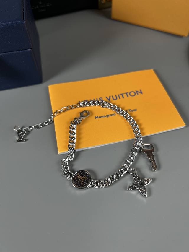 Lv Monogram Lock bracelet brings together brand elements in a fun way, with the