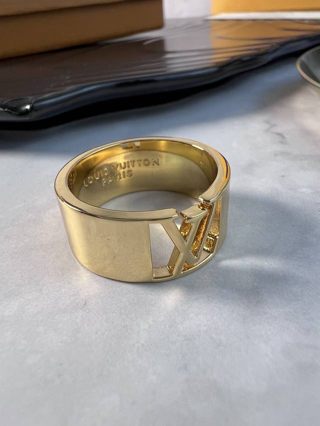 Lv This ring has the letter Lv in the center, and the wide band allows for flexi