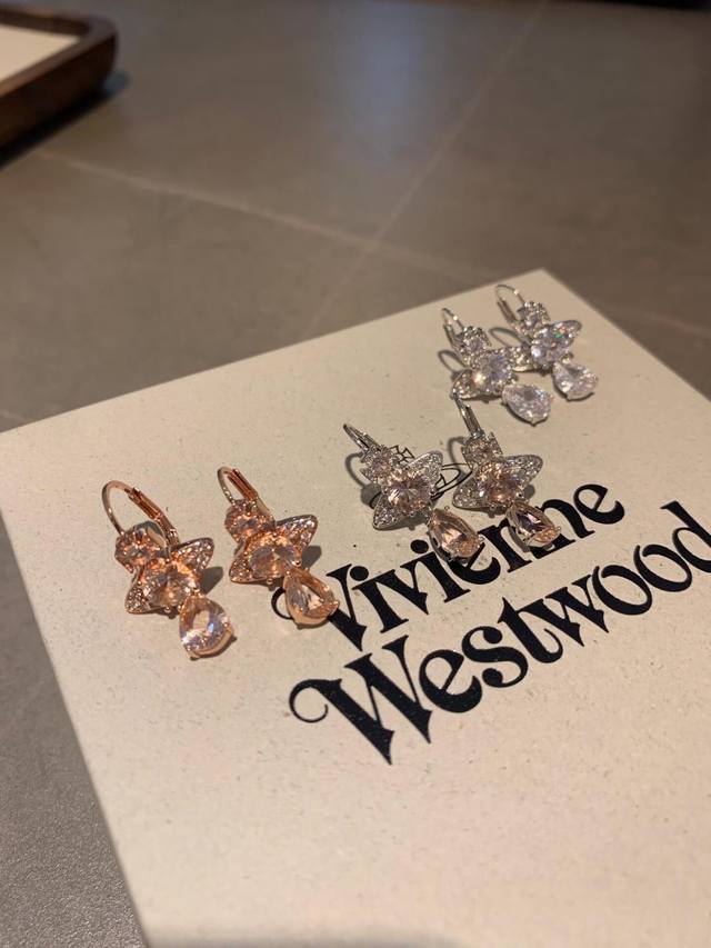 Vivienn Westwood Queen West Crown Planet Earrings Highly recommended, beautiful