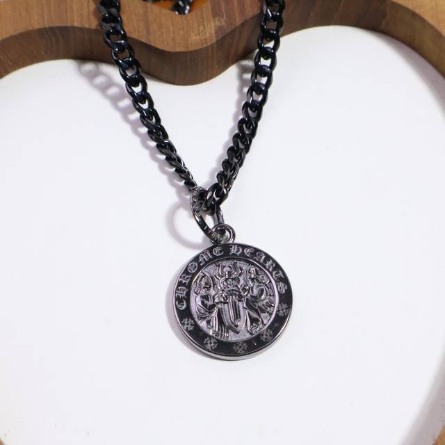 Chrome Hearts black gold necklace, different patterns and design styles present