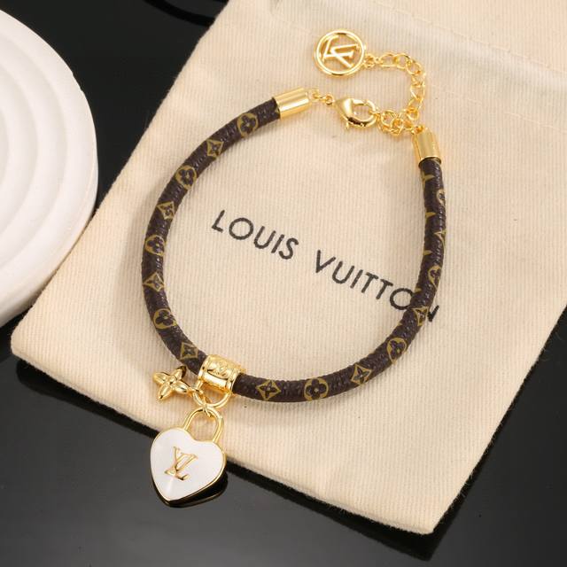 Lv Circle reversible bracelet features the iconic monogram canvas and gold metal