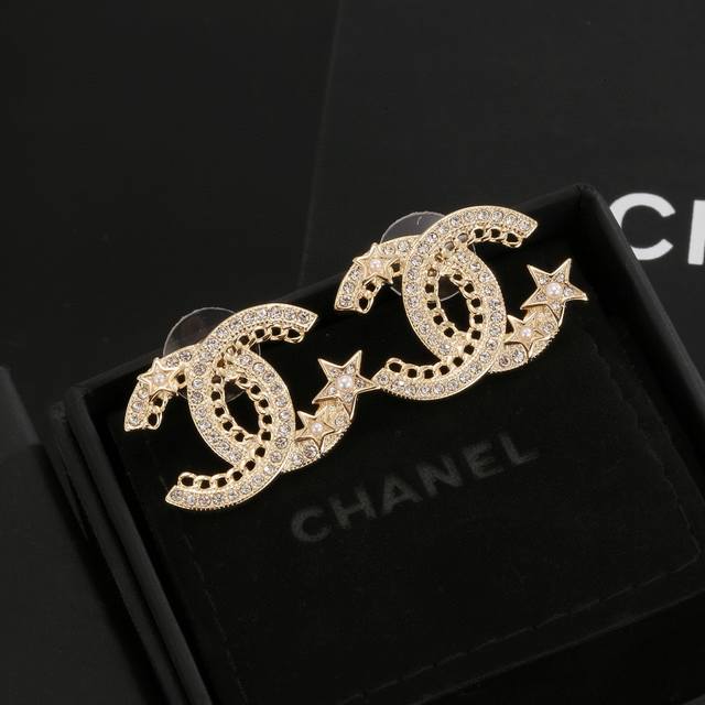 Chanel earrings are more flattering to the face. Surrounded by gold metal edges