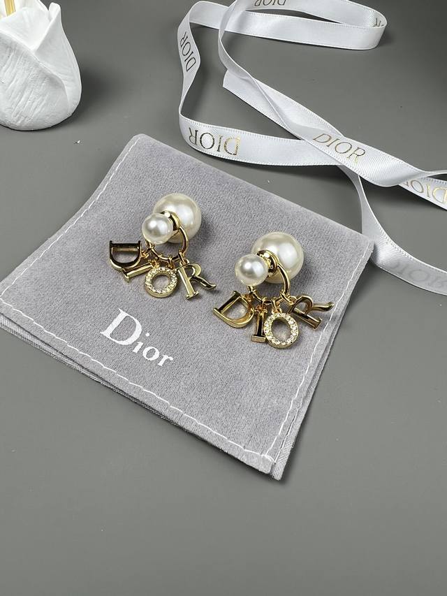 Dior Tribalos earrings are a new interpretation of Dior's iconic style. White re