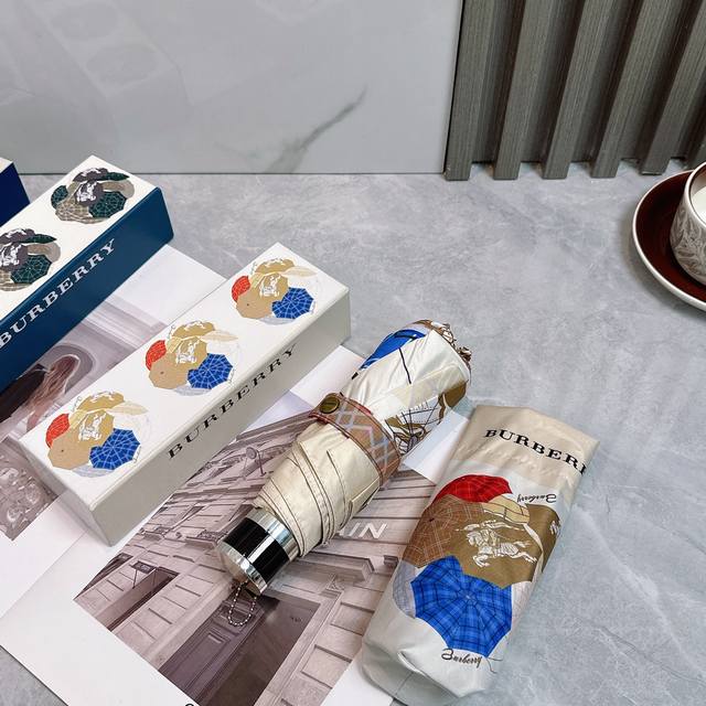 Burberry's new 50% foldable umbrella has a black sunscreen coating that effectiv