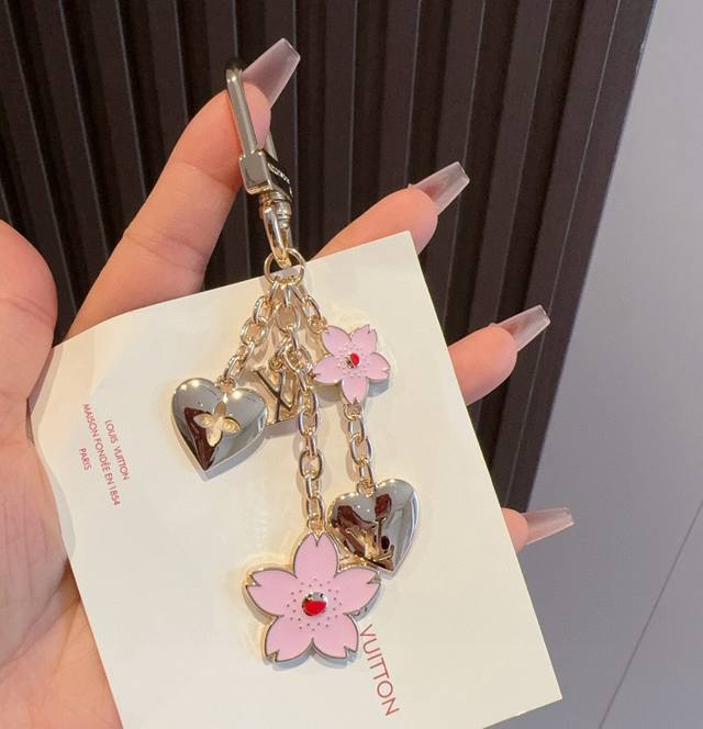 Lv keychain, a cherry blossom keychain bag charm from the Louis Vuitton x Muraka