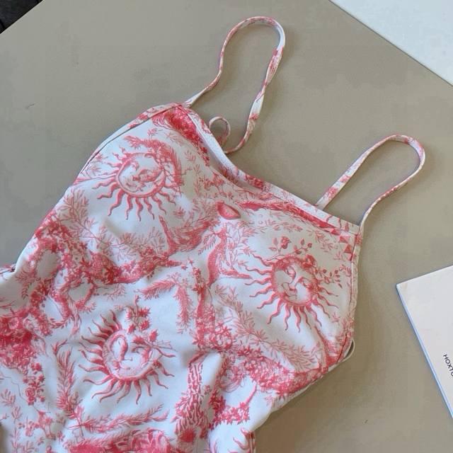 Highly recommended! This Dior one-piece swimsuit features a stylish, trendy anim
