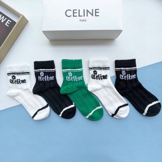 comes with a box of five pairs of Celine's popular mid-calf socks in the tall ve