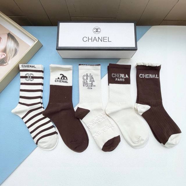 comes with a box of five pairs of Chanel's best-selling high socks, the tall ver