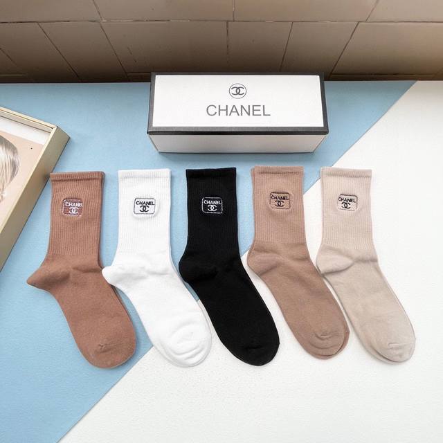 comes with a box of five pairs of Chanel's best-selling high socks. These are in