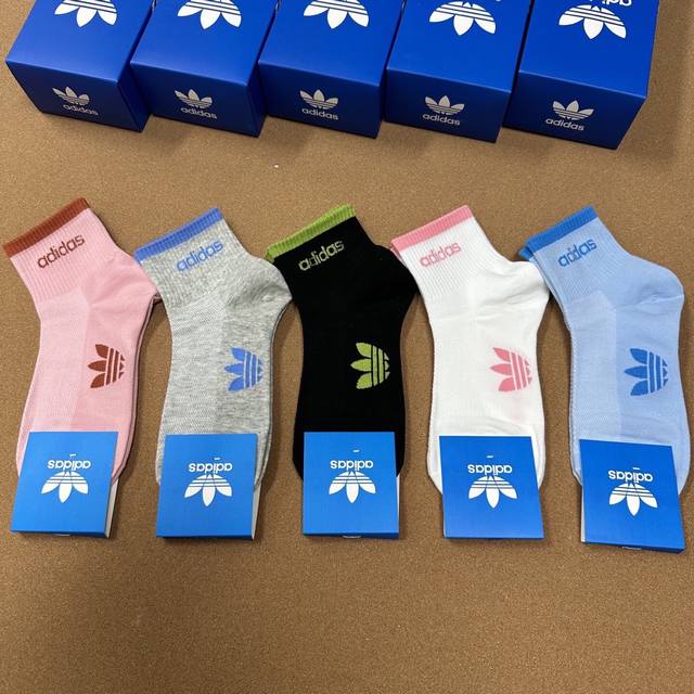 Special Adidas new women's mid-calf socks, with the popular Trefoil logo. Super