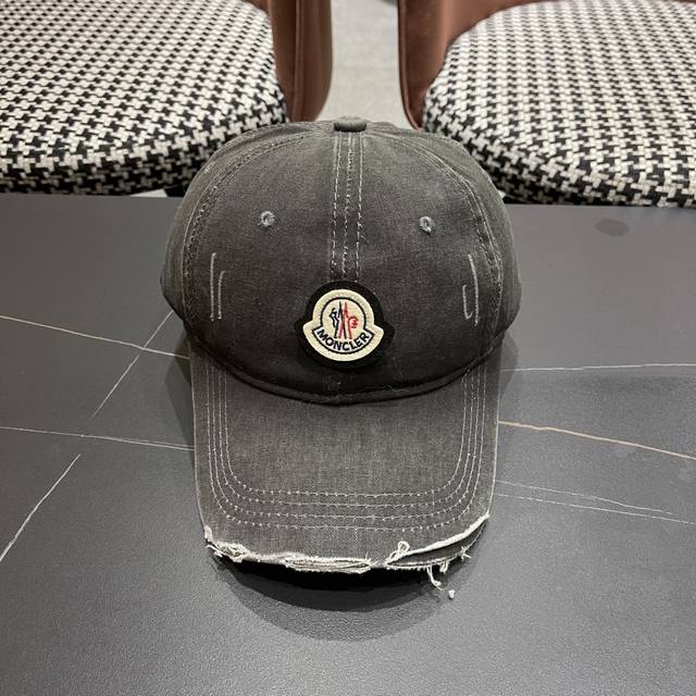 Moncler's new baseball cap features a canvas and cotton lining for a lightweight