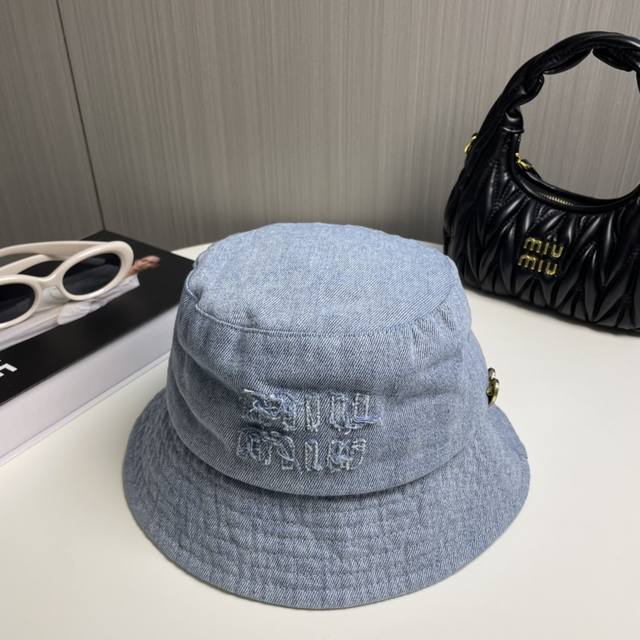 comes with a dust bag. This new Miumiu denim bucket hat is a designer-branded pi