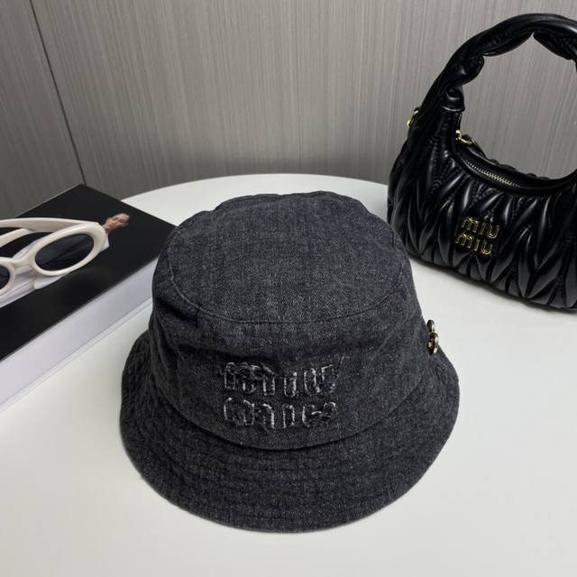 comes with a dust bag. This new Miumiu denim bucket hat is a designer-branded st