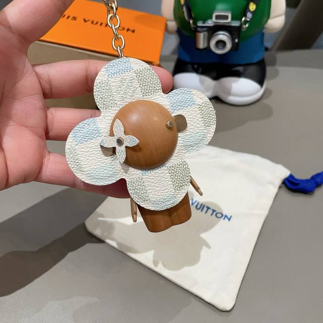 Louis Vuitton's new bag charms and keychains. LV Vivian sunflower bag charms and