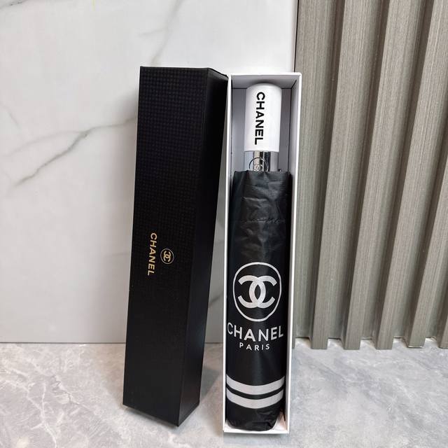 Chanel's new summer fully automatic folding umbrella. Its black coating effectiv
