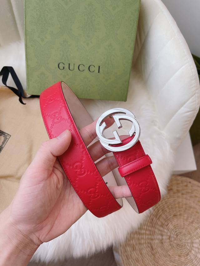 Gucci women's collection, featuring heat-embossed Gucci Signature leather for a