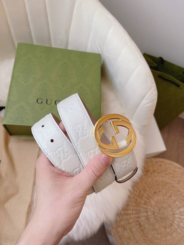 Gucci women's collection, featuring heat-embossed Gucci Signature leather for a