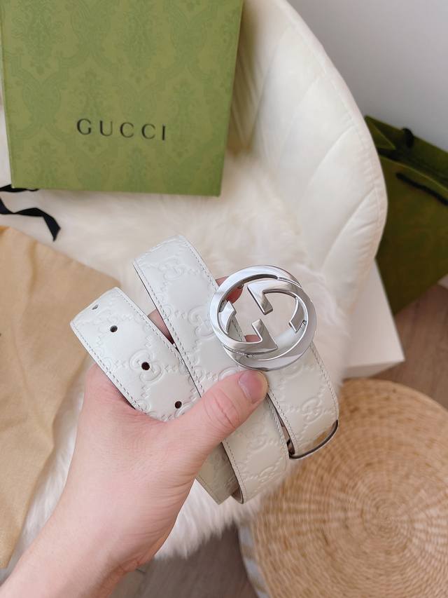Gucci women's collection, featuring heat-embossed Gucci Signature leather for a