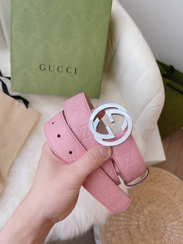 Gucci women's collection, featuring heat-embossed Gucci Signature leather for a