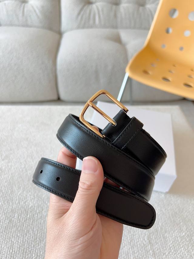 The Row minimalist calfskin belt with visible texture, very versatile; casual pi