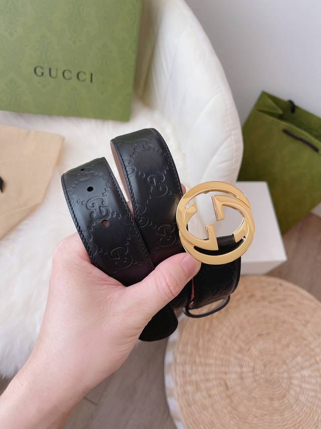 Gucci women's collection, featuring heat-embossed Gucci Signature leather for a