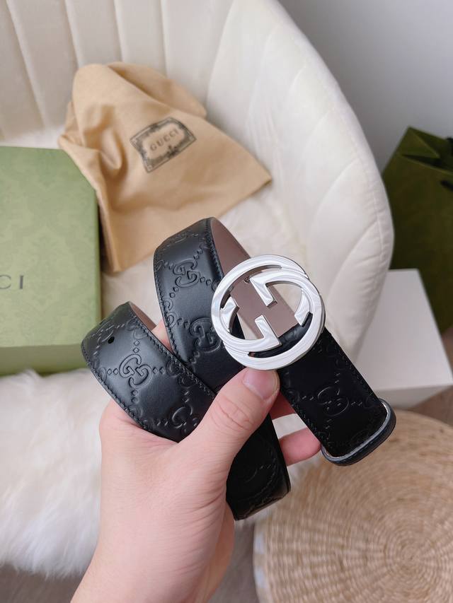 Gucci women's collection, featuring heat-embossed Gucci Signature leather for a