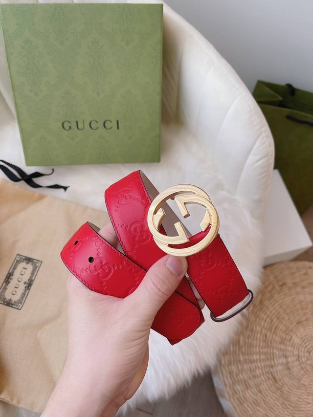 Gucci women's collection, featuring heat-embossed Gucci Signature leather for a