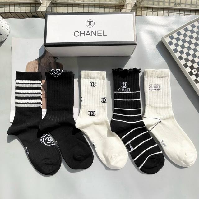 comes with a box of five pairs of Chanel's best-selling high socks. These are in
