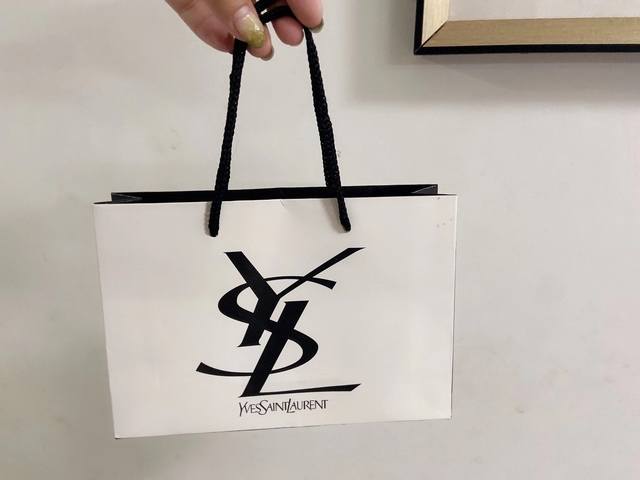 A four-piece, white boxed, designer-quality Yves Saint Laurent lipstick and perf