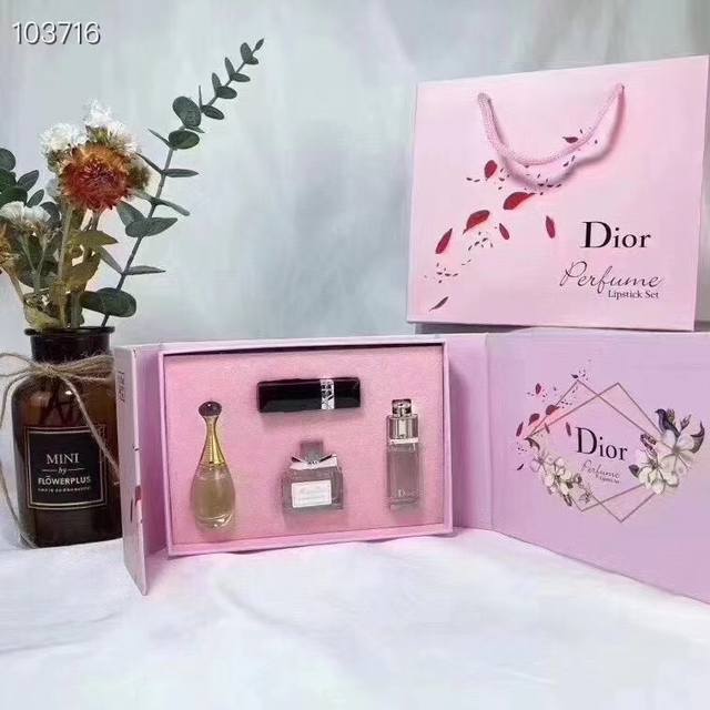 A four-piece, designer-quality Dior lipstick and perfume sample set with a compa
