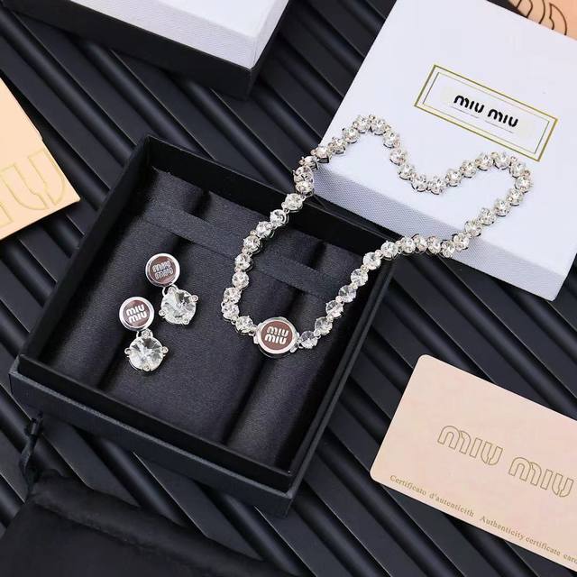 Miumiu enamel button full diamond necklace. Miumiu's logo design elements are mi