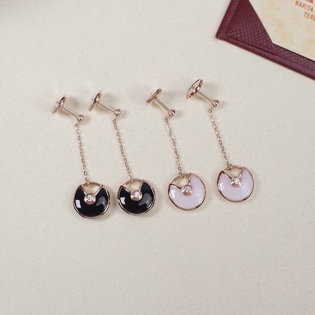 Amulette De Cartier long amulet earrings, priced at 28300. Purchased from the je